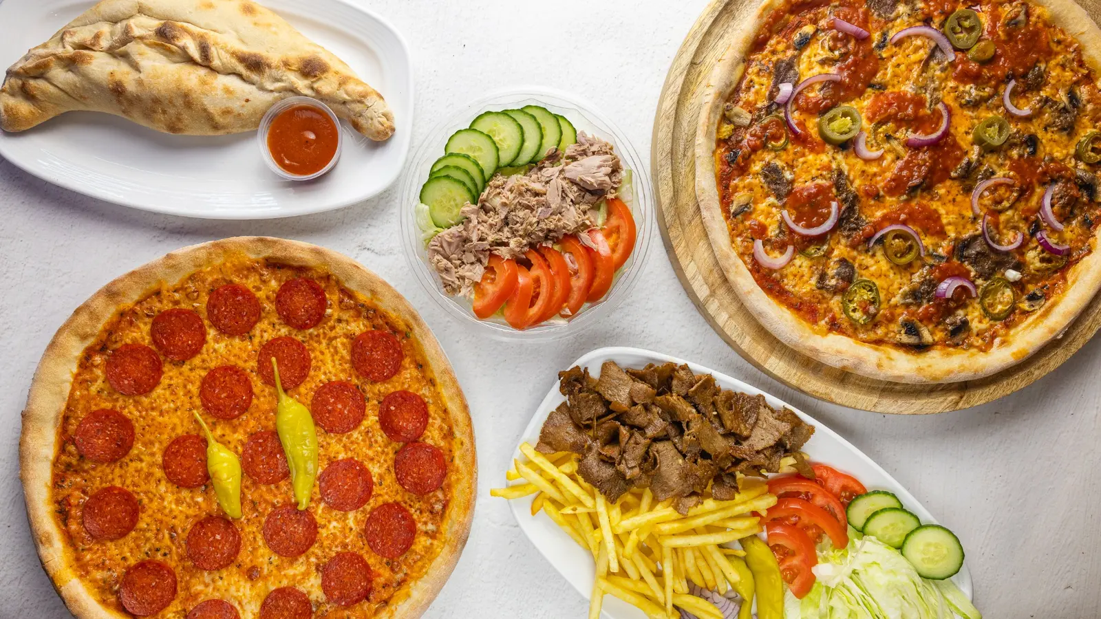 Pizza, calzone, salad and kebab plate from Pizza Express City